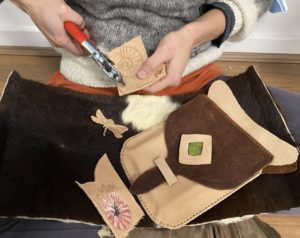 Dora makes beautiful leather objects by hand